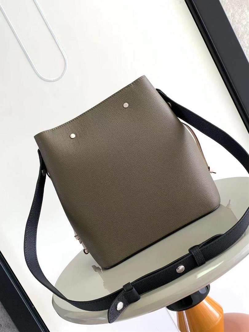 M54677s latest water bucket bag features imported soft calf leather with a shiny twist lo