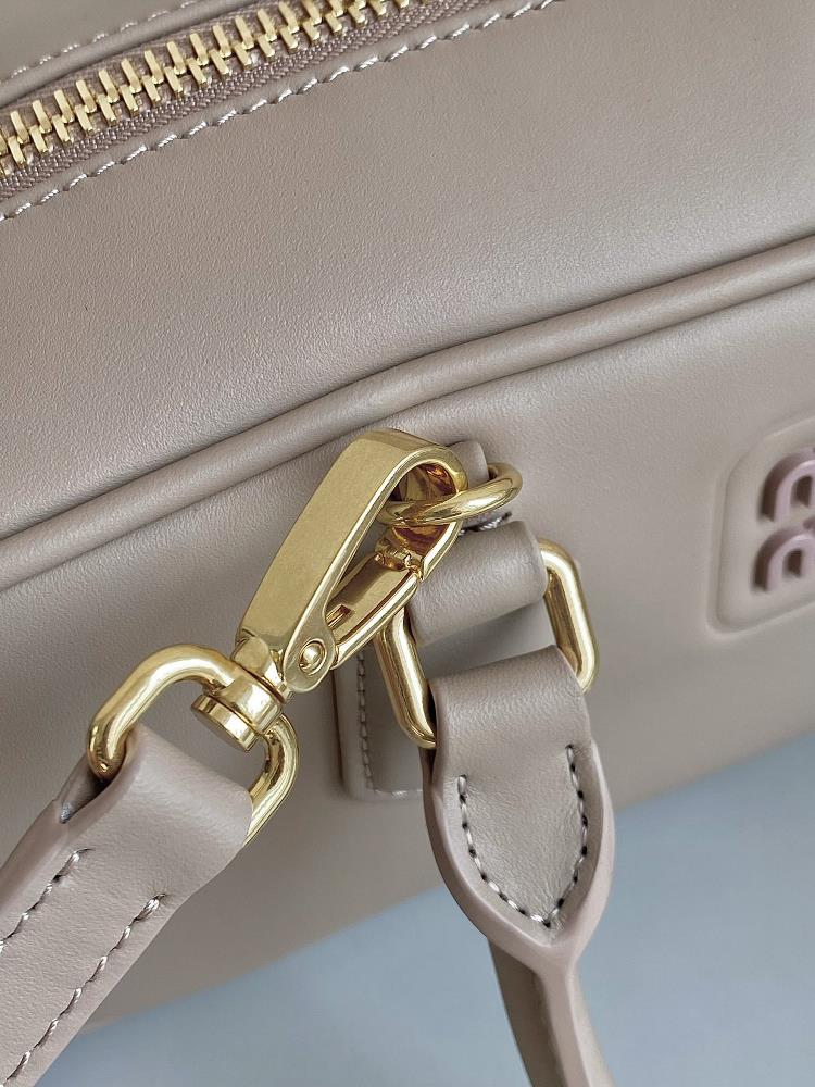 In a world full of trends and fast fashion the Miumiu Bowling bag in Milk Tea color stand